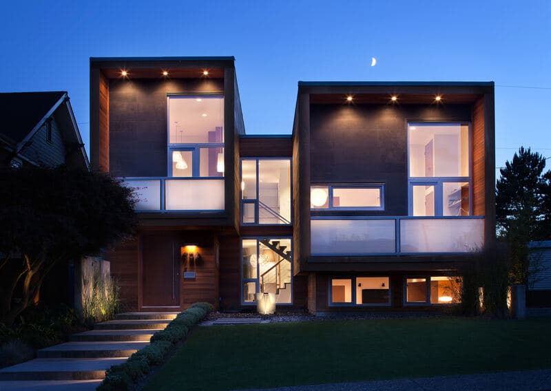 Open-plan living area with floor-to-ceiling windows.